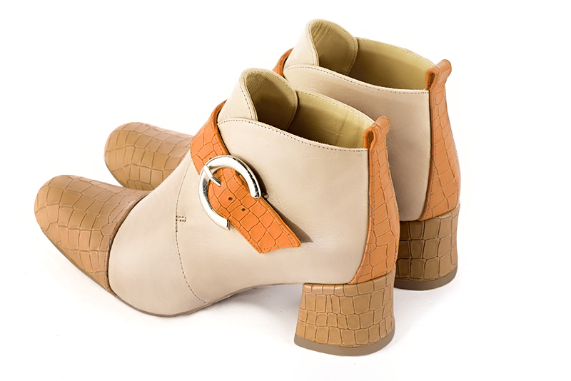 Camel beige, champagne white and marigold orange women's ankle boots with buckles at the front. Round toe. Low flare heels. Rear view - Florence KOOIJMAN